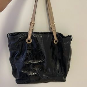 Michael Kors Patent leather style bag in black.
